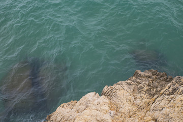 Landscape where the rocks of the coastline and turquoise sea are