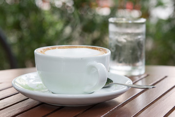 cup of coffee on wooden