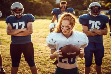 Poster American football woman player in action on the stadium © selenit