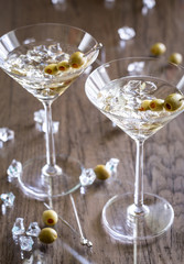 Two olive martini cocktails