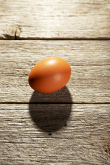 Chicken egg on grey wooden background