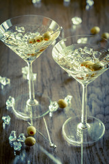 Two olive martini cocktails