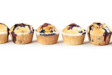 Tasty blueberry muffins isolated on a white