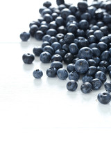 Blueberries on a white wooden background
