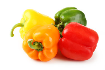 Four fresh pepper isolated on white