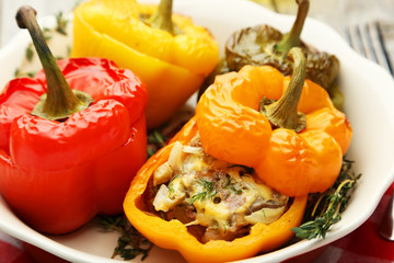Red and yellow peppers stuffed with meat, rice and vegetables