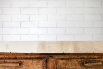 Empty table and white brick wall background