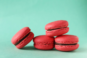 Red macarons on green background