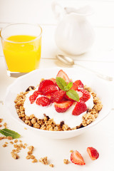 Yogurt with homemade granola and strawberries