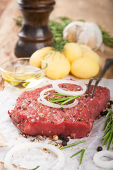 Raw beef steak and spices