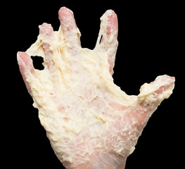 dough in hand on a black background