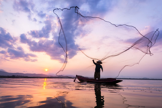 Fisherman of Bangpra Lake in action when fishing Thailand