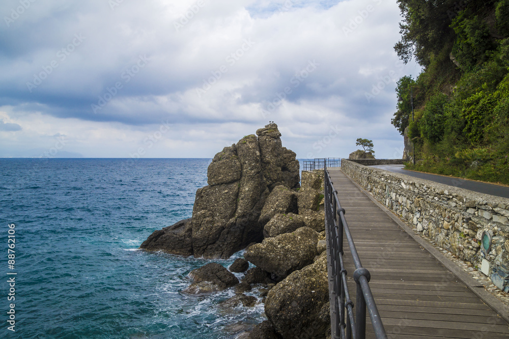 Poster Dramatic scene at Portofino - La Spezia ,clouds and rocks on the Mediterranean coastal cliff beach.