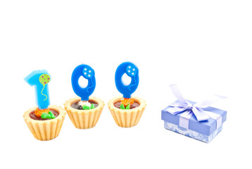 three cakes with one hundred years birthday candles and gift