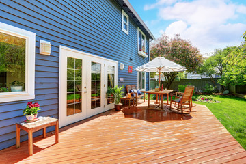 Picture perfect back deck with covered seating.