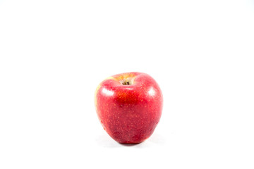 red apple in wooden basket
