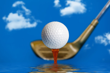 Golf ball on the tee over water