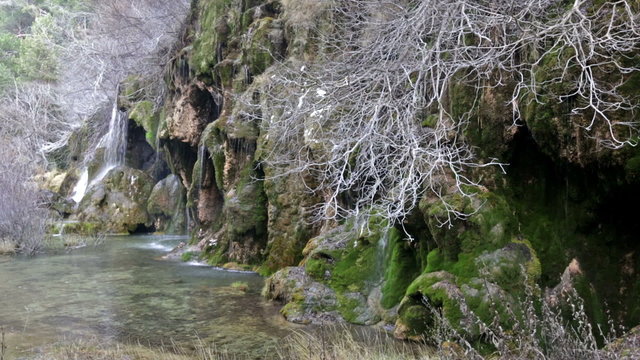 Natural   waterfall at river  in winter. Cuenca, Spain
