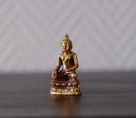 A bronze statue of a Buddha