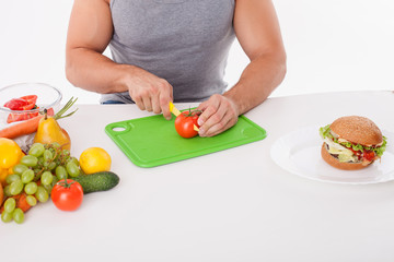 Fit young man is preparing healthy food