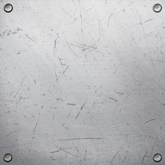 Metal plate with rivets