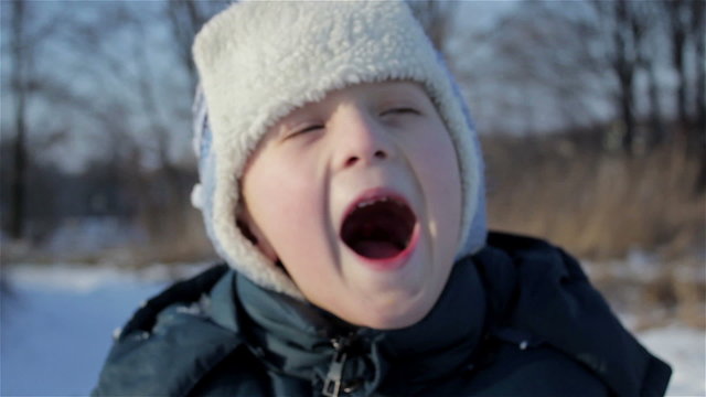 Boy screaming in winter/happy boy screaming winter and smile upon the face of rejoicing winter