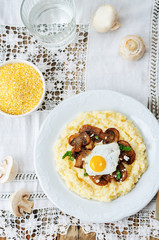 polenta with caramelised mushrooms, egg, cilantro and cheese