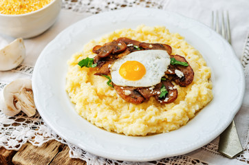 polenta with caramelised mushrooms, egg, cilantro and cheese