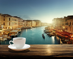 Fototapeta premium coffee on table and Venice in sunset time, Italy