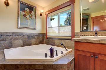 Lovely master bathroom with stone floor.