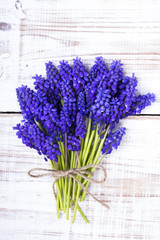 Muscari bouquet on a white wooden table