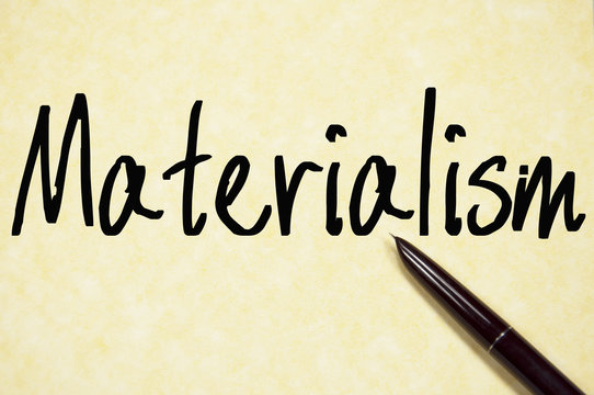 materialism word write on paper