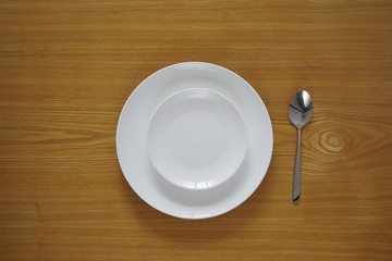Empty set of plates from top view with spoon