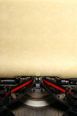 Old vintage typewriter with blank paper