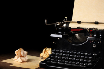 Fototapeta na wymiar Old vintage typewriter with blank paper