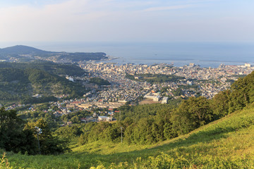 Fototapeta na wymiar Otaru cityscape viewed from the mountains