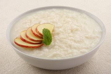 Rice pudding with milk and apples.