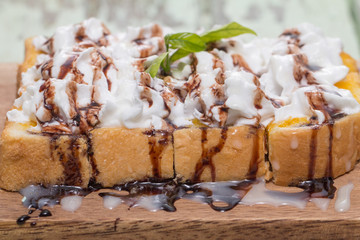Toast cream is placed on a wooden table