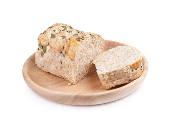 whole wheat bread in the wooden plates isolated on white backgro