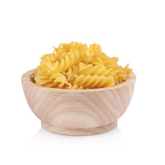 Pasta in wooden bowl, isolated on white background