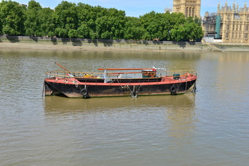 Fototapeta na wymiar A Thames river barge at rest on the Thames at Westminster.