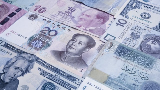 Various currency notes background. Dollar, Euro, Yuan, Lira, Kuna, Shekel and others. Dolly shot
