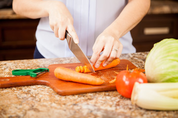 Cutting some carrots in the kitchen