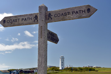 Signpost on Dorset coastal path at Portland Bill