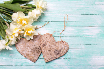 Bright white daffodils and two decorative hearts