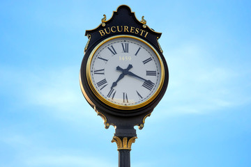 Fototapeta na wymiar Parliament clocks in Bucharest city 