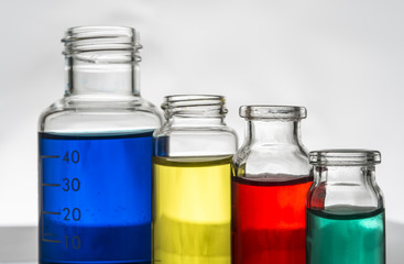 Set of laboratory bottles with color liquid
