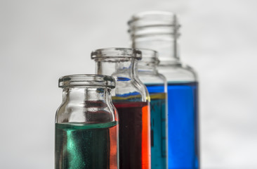 Set of laboratory bottles with color liquid