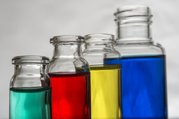 Set of laboratory bottles with color liquid