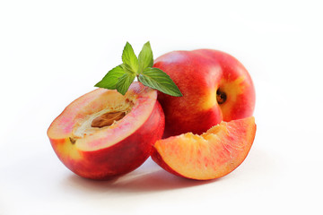 Fototapeta na wymiar Peaches and mint isolated on white background